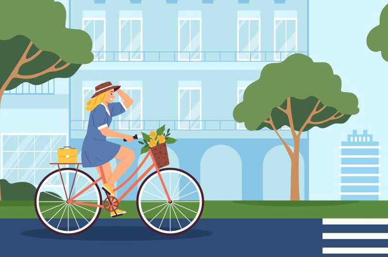 Grafika przedstawia kobietę jadącą na rowerze.